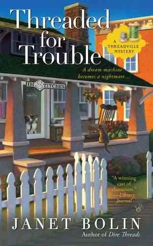 Threaded for trouble / Janet Bolin.